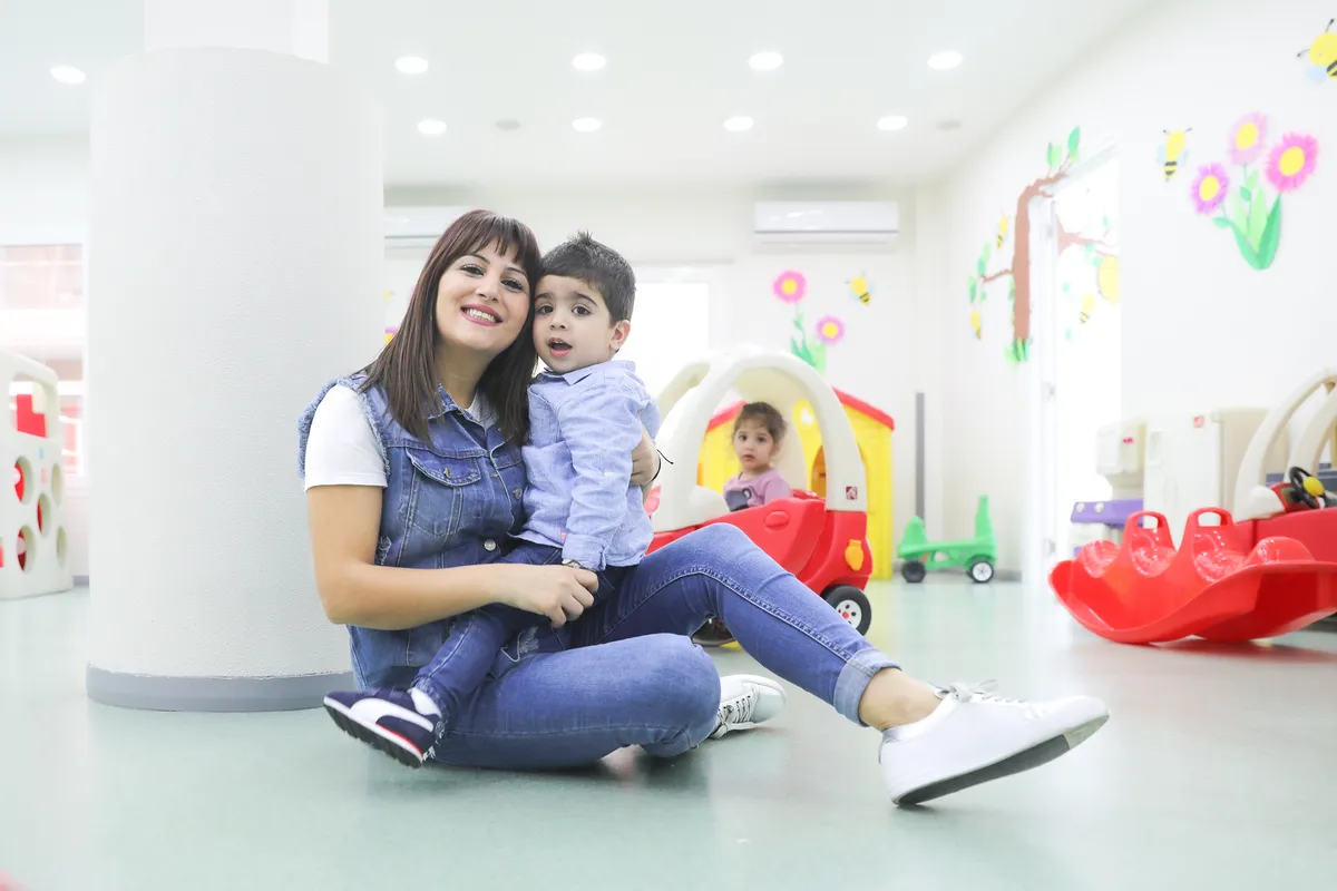 Caring staff supporting a child's development